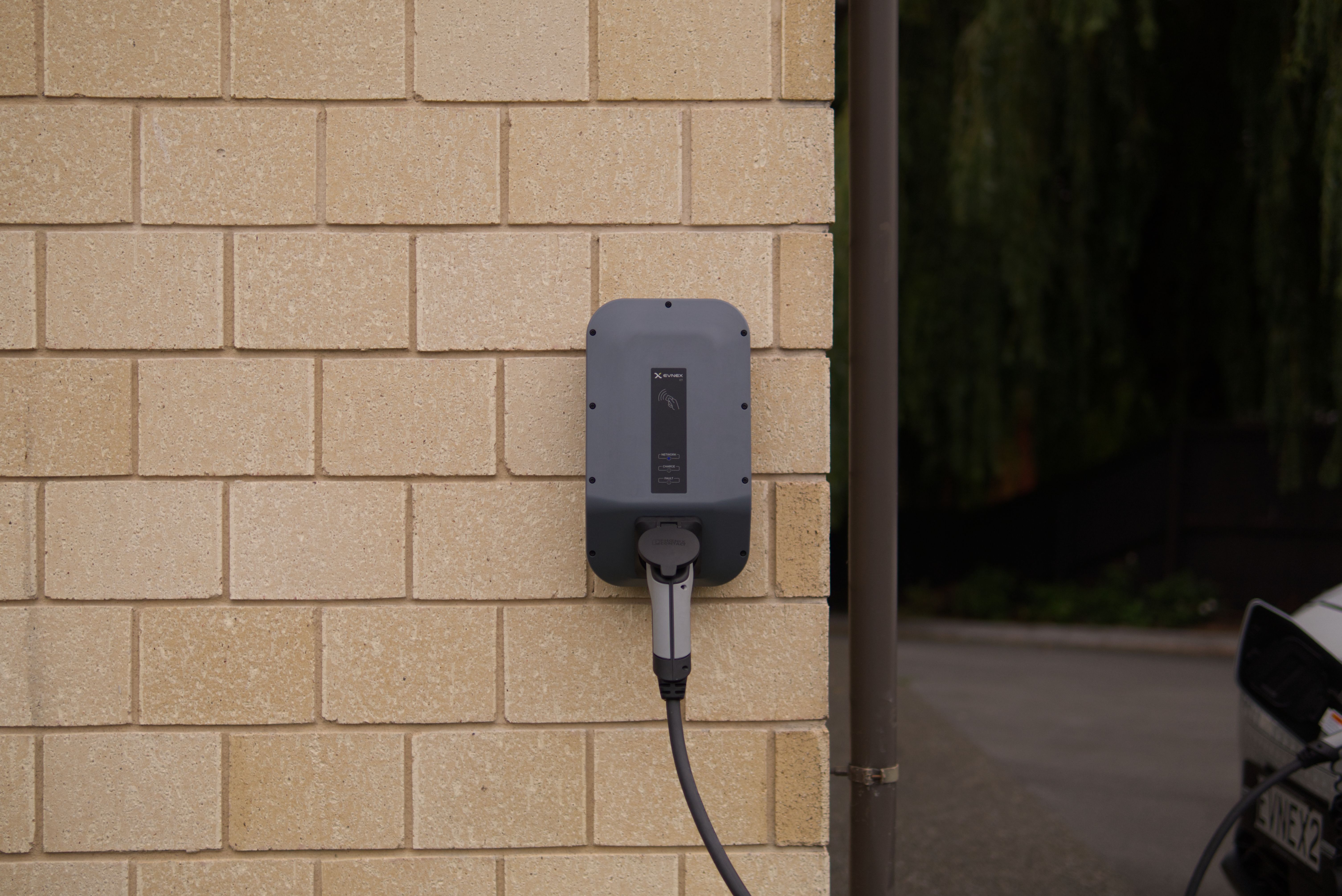 EV charger installed on a garage wall